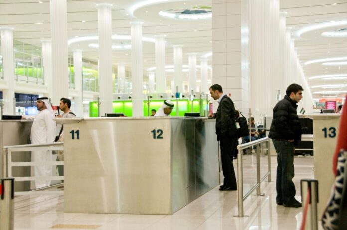 People at Immigration in Dubai International Airport United Arab Emirates